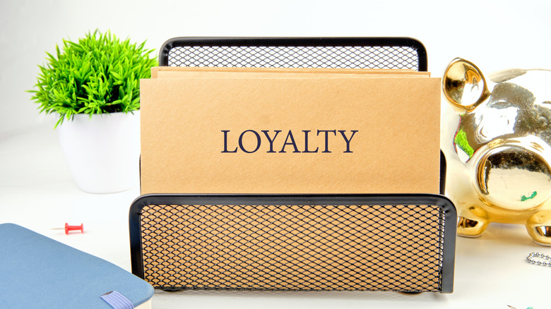 a folder with loyalty printed on the front