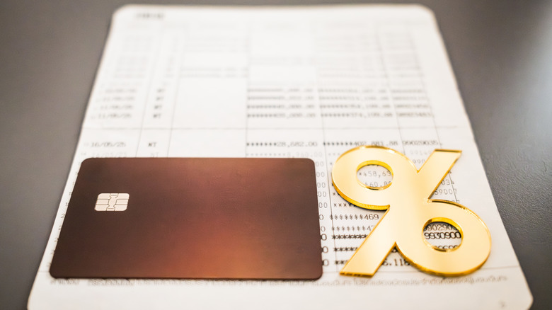 credit card, percentage symbol, and account statement