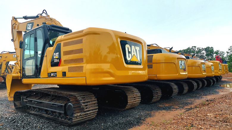 a row of Caterpillar equipment