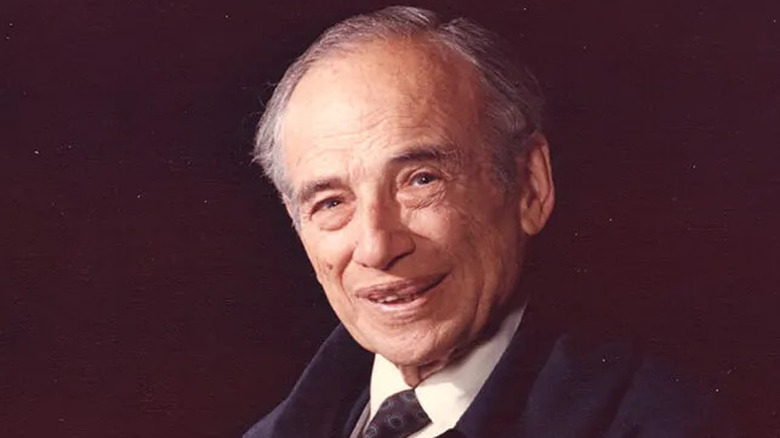 vintage portrait of Benjamin Graham wearing dark medallion necktie