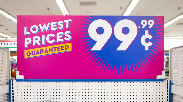 Shelves, with a sign promoting "Lowest Prices Guaranteed," at $.99, are nearly empty.