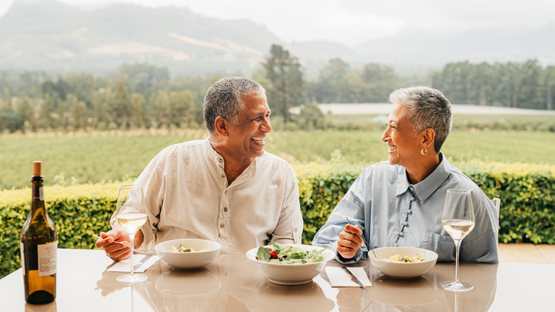 senior smiling in vineyard