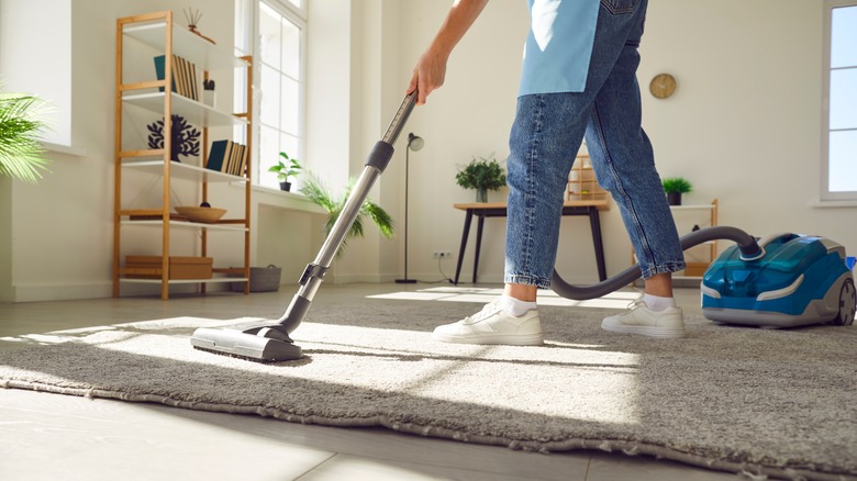 cleaner vacumming the floor