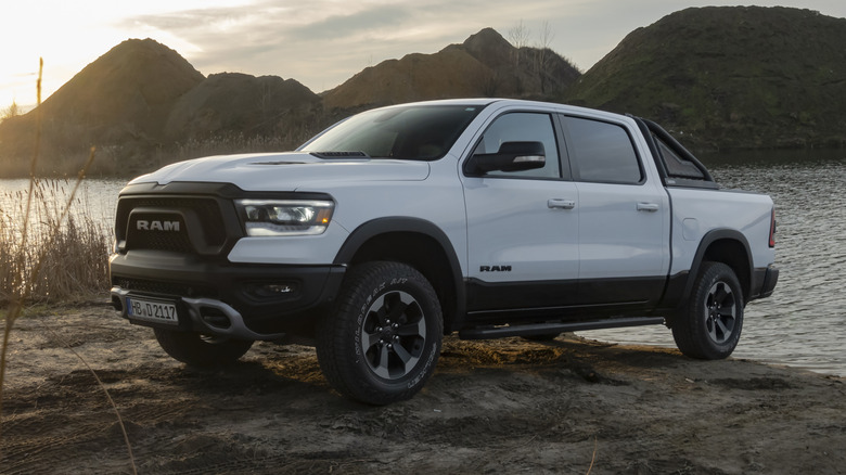 RAM 1500 Rebel stopped next to lake in a sunset.