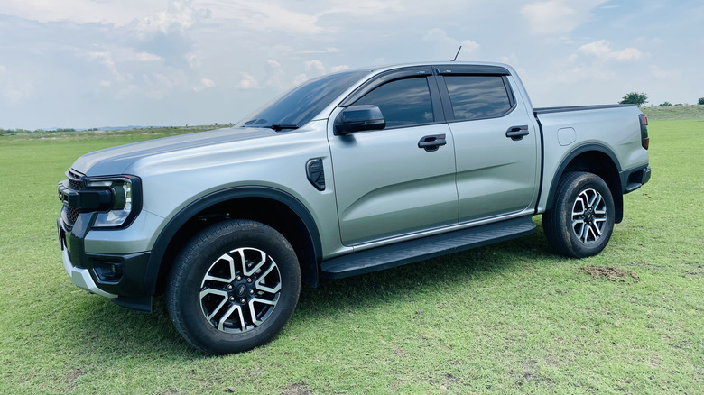 Ford Ranger Sport 4x4  parked in a grassy field.