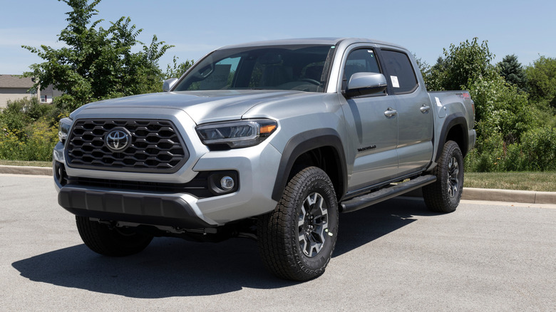 Grey Toyota Tacoma on display at a dealership.