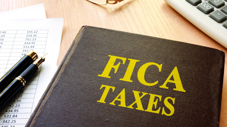 A "FICA taxes" label on a leather notebook