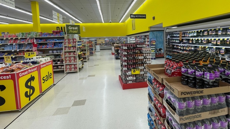 The back aisle of a Harvey's Supermarket stocked with drinks and snacks but empty of shoppers.