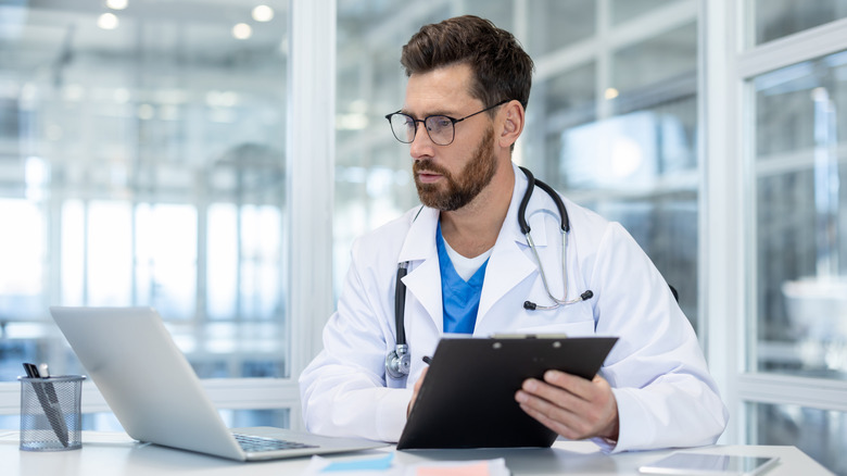 Doctor prepares treatment report