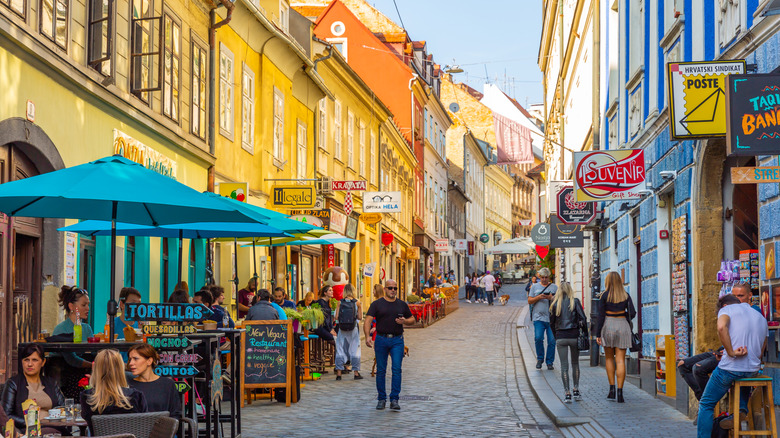 A busy city street filled with pedestrians