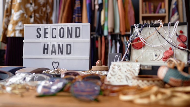 Second Hand sign and a variety of items for sale