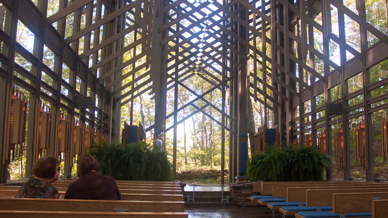 Inside of the Thorncrown Chapel with panoramic forest views