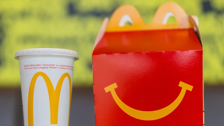 A McDonald's Happy Meal box with a drink