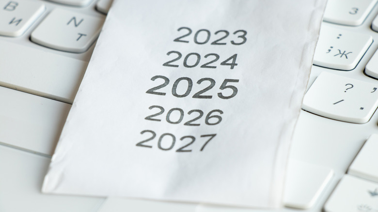 List of years on a paper resting on a keyboard