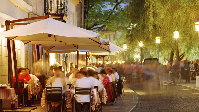 Diners eating at a street cafe