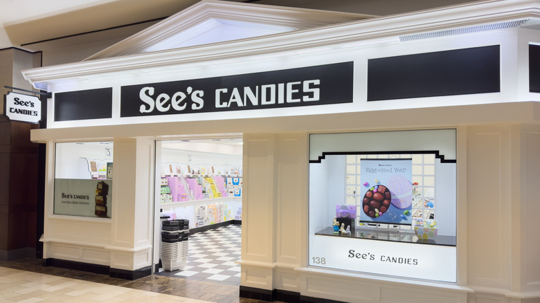 An old-fashioned See's Candies storefront in an indoor shopping center, complete with famous black and white porcelain floor.