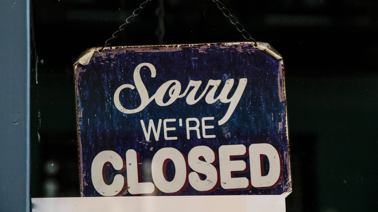 'Sorry, we're closed' sign in window