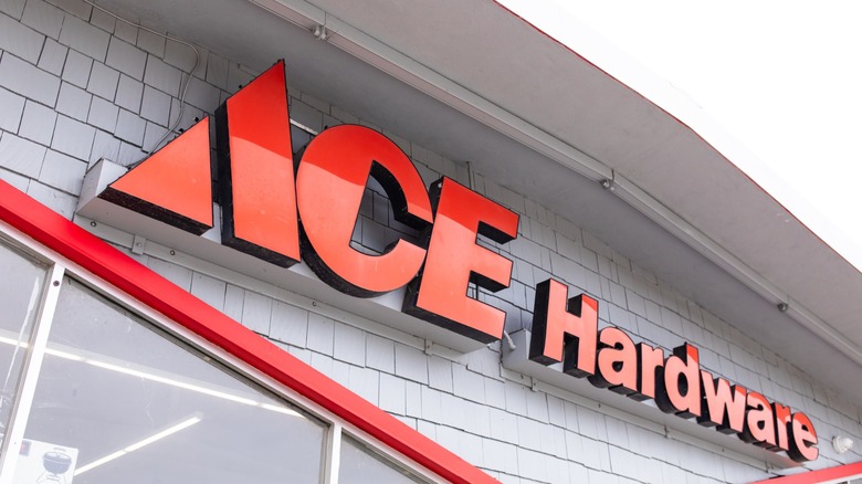 Red Ace Hardware sign mounted above the windows of a store
