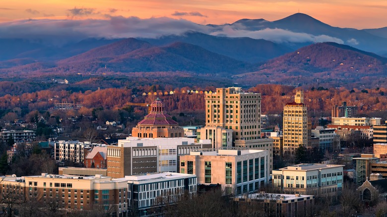 Skyline of city with mountains in background
