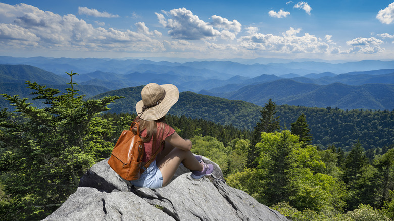 Female hiker looking at view of mountains