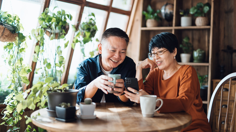 A mature couple in a kitchen