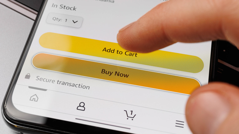 Hand adding item to cart in Amazon app