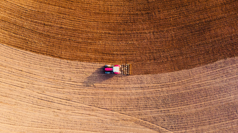Tractor on dry farm land