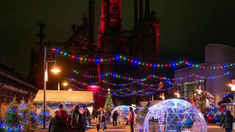 People shopping at an outdoor Christmas market