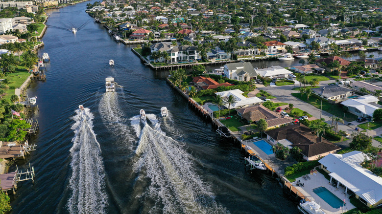 Boats racing in both directions through Deerfield Beach, Florida