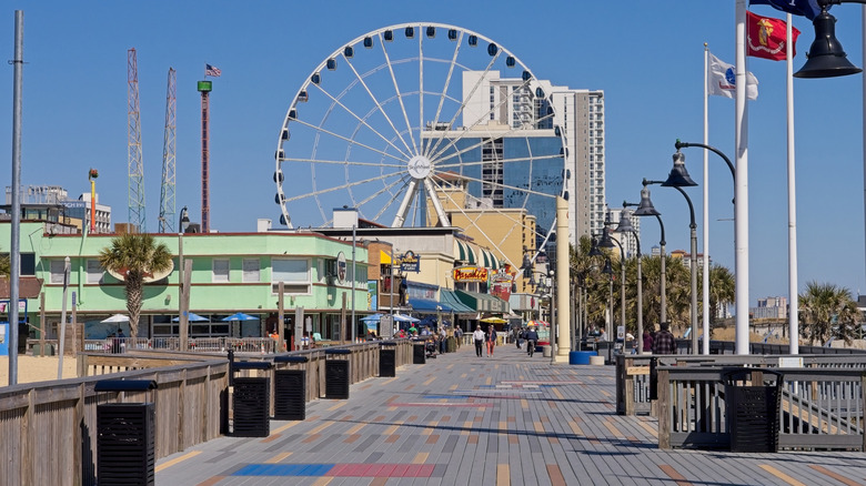 The boardwalk at Myrle Beach, featuring restaurants, shops, and a ferris wheel