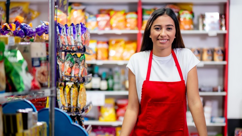 Beautiful portrait of a neighborhood mini supermarket manager.