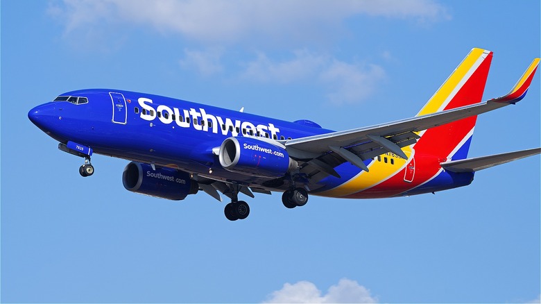 Southwest plane flying below clouds