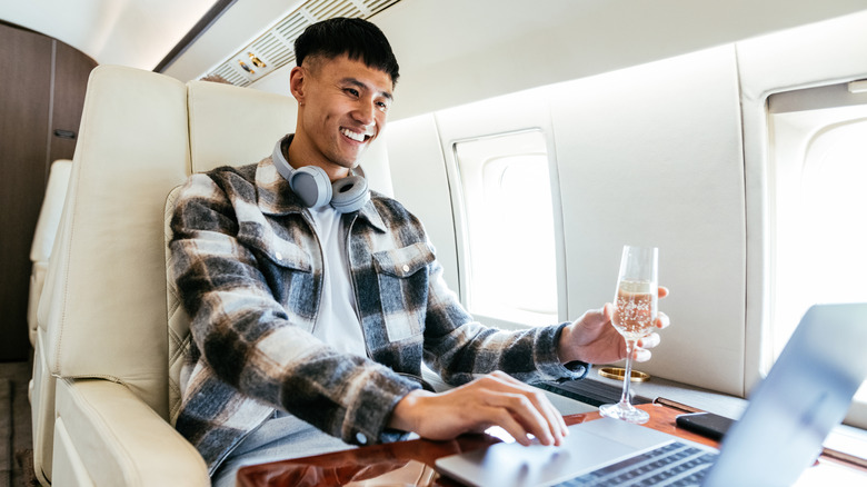 Wealthy passengers using private luxury jet to travel to destination