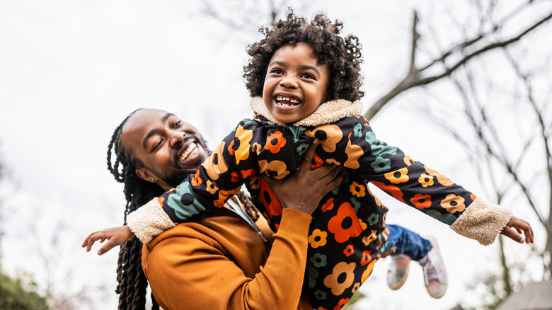 a Black father and daughter