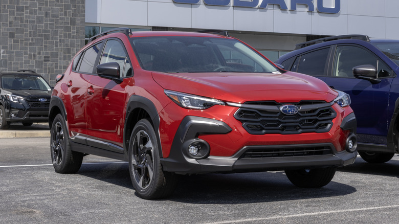 Subaru Crosstrek Limited AWD Compact SUV at a dealership.