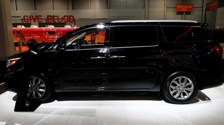 A black 2020 Kia Sedona is on display at the 112th Annual Chicago Auto Show