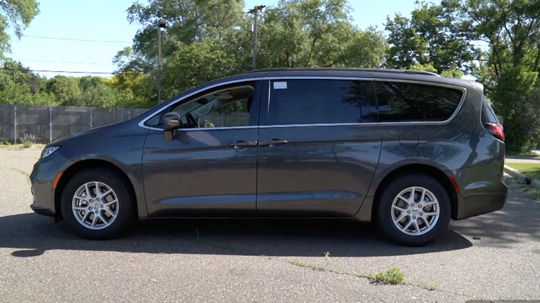 Side view of a gray 2022 Chrysler Pacifica Touring L in a parking lot