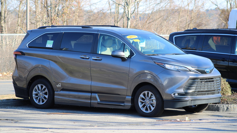 A gray Toyota Sienna Hybrid parked in a parking lot