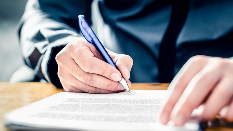 A person signing a document