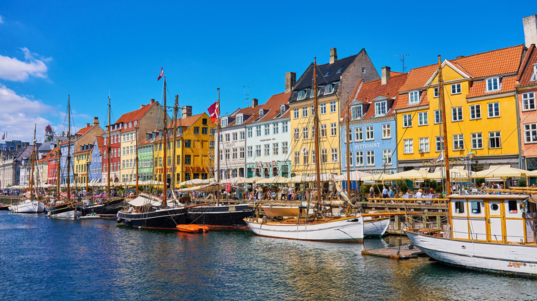 Nyhavn Harbour in Copehagen with boats and buildings