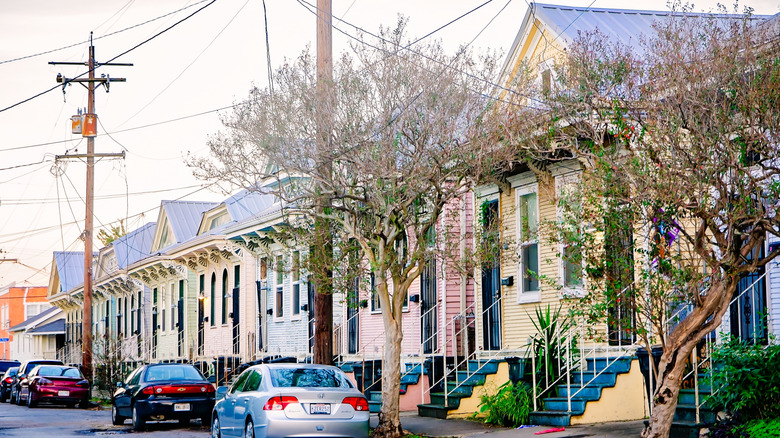 row of double shotgun houses with metal roofs in New Orleans, Louisiana