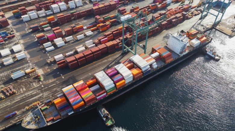 Overhead view of a container ship docked at port.