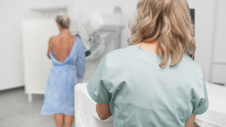 A woman getting a mammogram