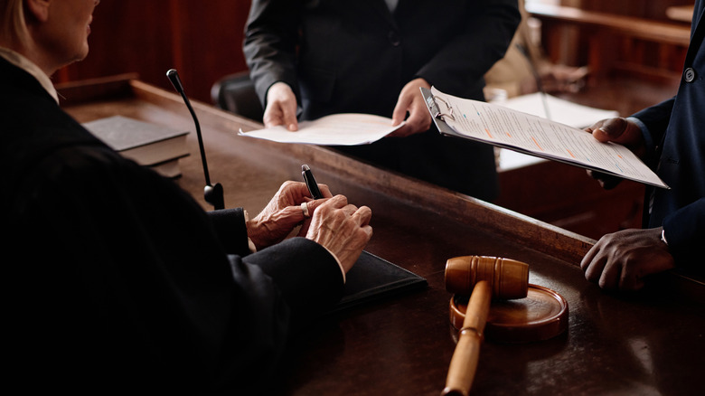 Close-up shot of a judge with counsel in front of the bench