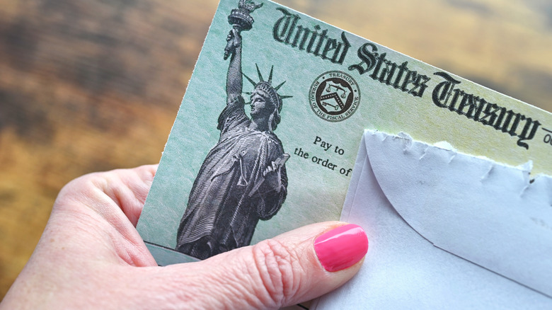Person holding Social Security check