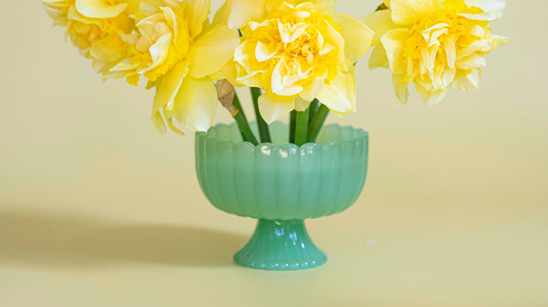 Ornamental jadeite vase with yellow flower