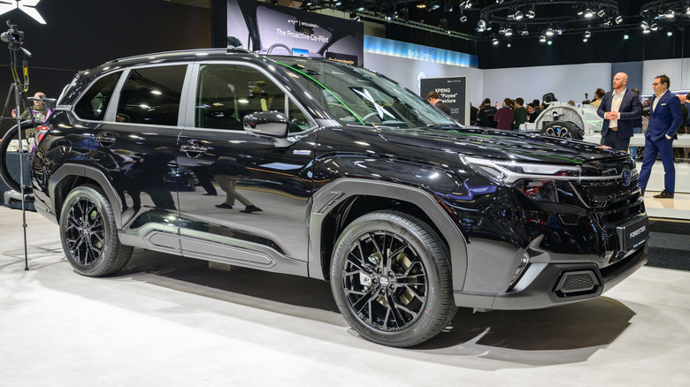 A black Subaru Forester on display at a 2026 auto show