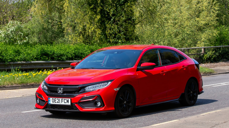 2021 red Honda Civic sport car on an English road.
