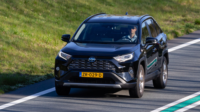 A Toyota 5th generation RAV4 SUV approaching on the Dutch motorway