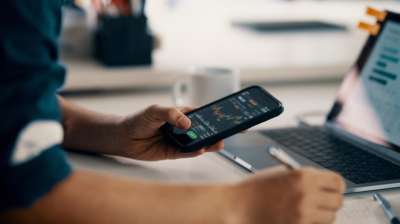 Person recording stock figures